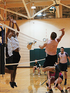 students playing a volleyball match