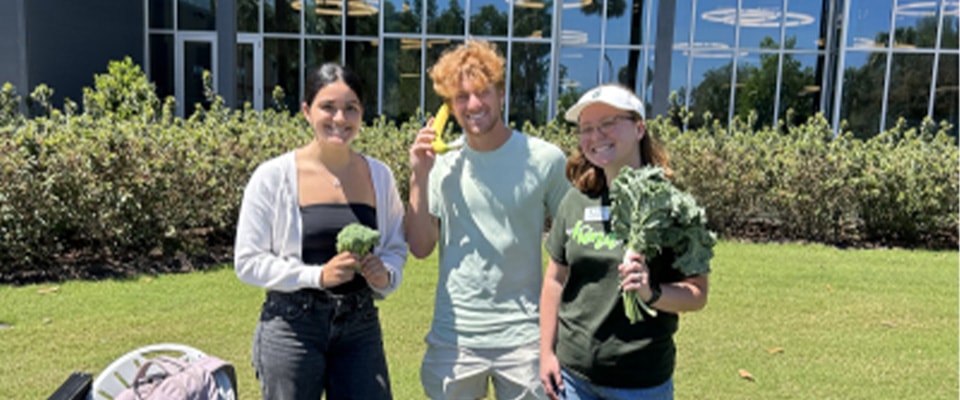 well team group picture with vegetables