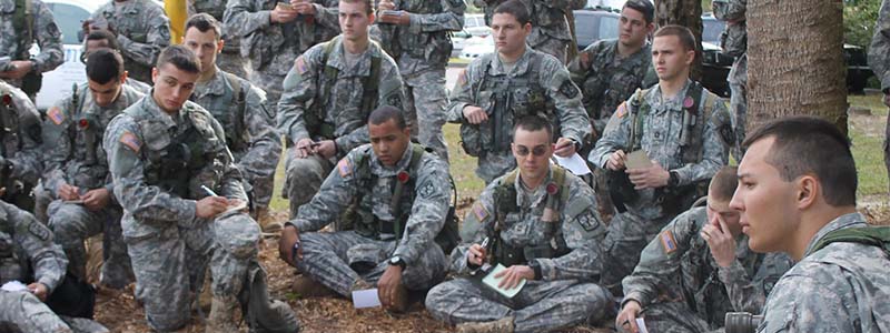 students in uniform planning outdoors