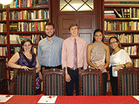 Members of Lambda Pi Eta gathering for a formal event