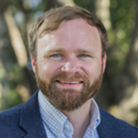 faculty member Jesse Fox smiling