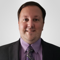 faculty member Bradley McKibben smiling