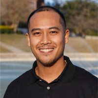 faculty member Tim Eng smiling