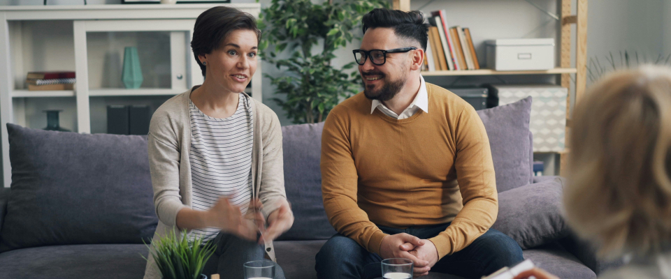 a counselor and couple in a couple counseling session