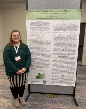 Lydia Morgan poses with her poster