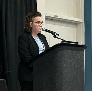 nicole king speaking at a podium