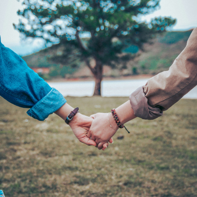 two people holding hands