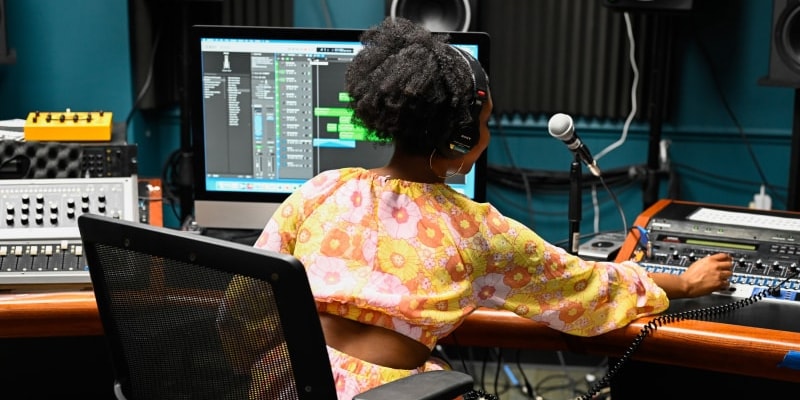 student in digital arts audio studio