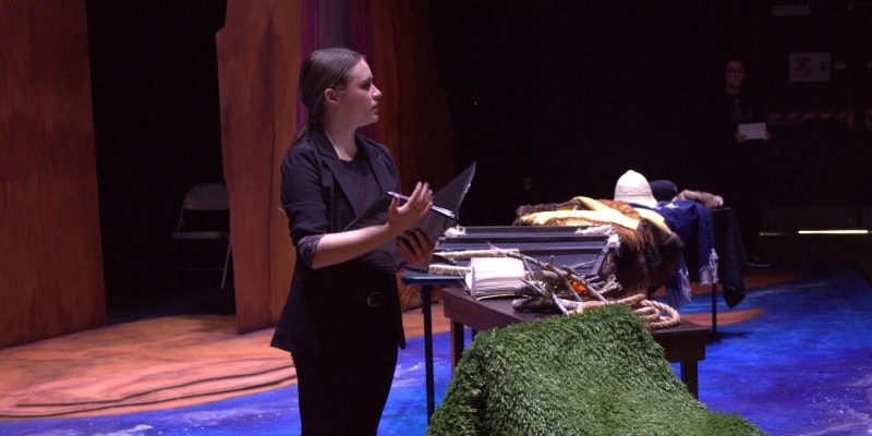 student preparing stage props