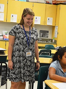 teacher walking around classroom