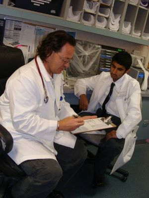 Stetson pre-health student Adam Rawji, with Dr. John Canalizo in the emergency room at Florida Hospi