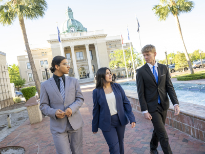 students walking outside court office