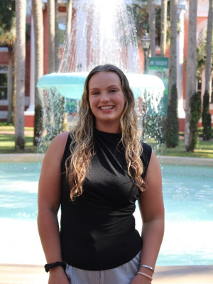 A person standing in front of a fountainAI-generated content may be incorrect.