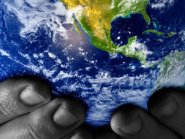 Hands holding Planet Earth