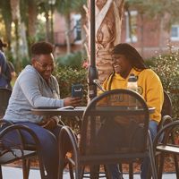 Stetson students at table outside