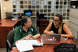 Bonnie Holloway working with a student