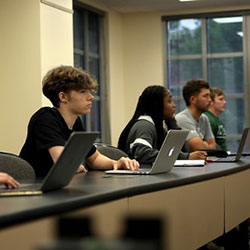 students in the classroom listening to professor