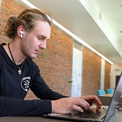 student working on their laptop