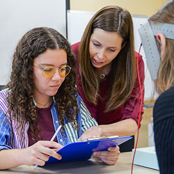 professor assisting student in psychology experiment