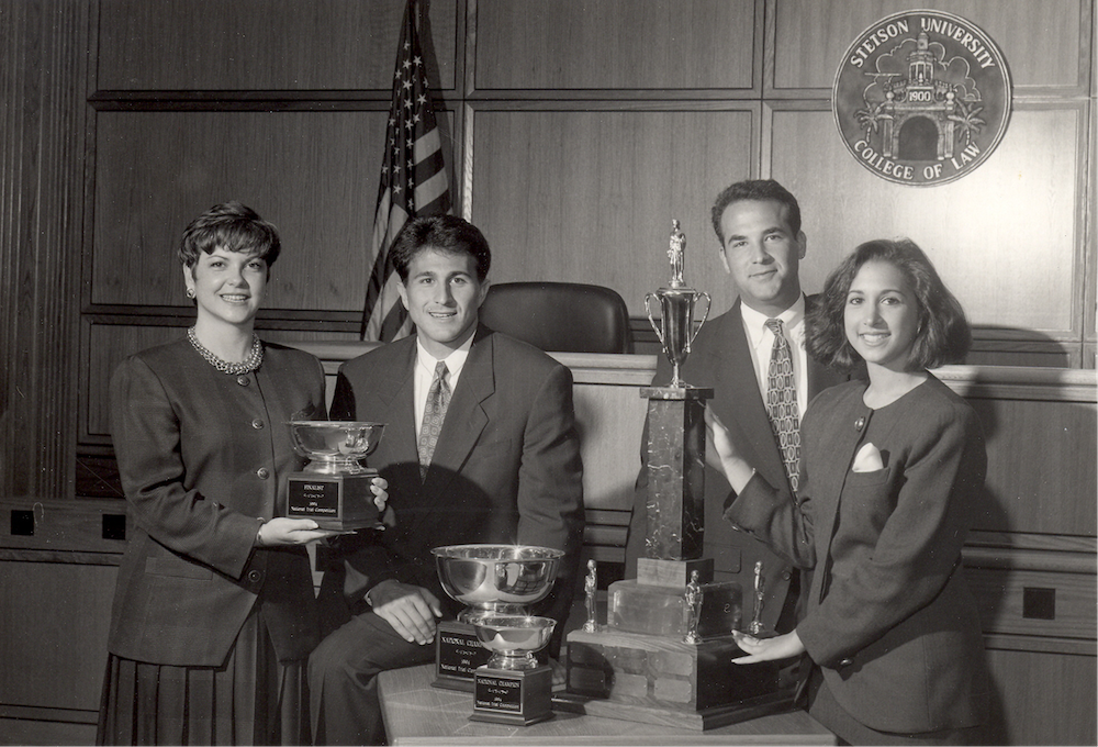 1994 Trial Advocacy Champions pose with award