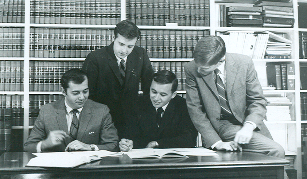 Stetson Law Review students gathered at a desk