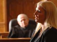 woman speaking while judge looks on