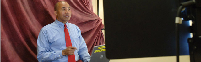 Judge Davis standing in front of screen