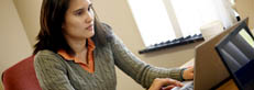 Student sitting in front of laptop