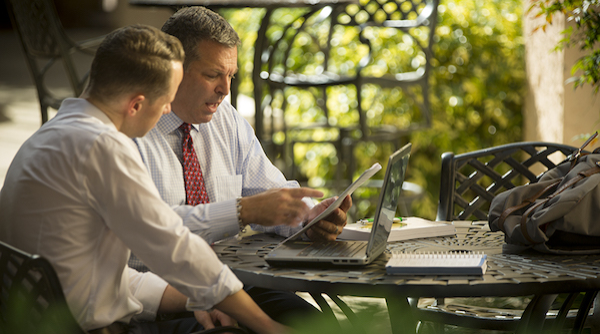 Professor Jason Palmer advises a student