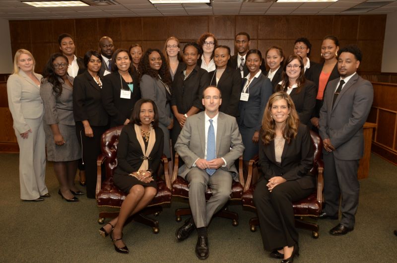 Group poses at event hosted by Institute for Caribbean Law and Policy