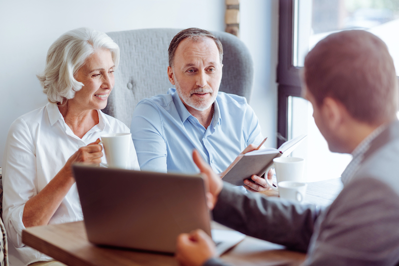 Elderly couple talks with lawyer