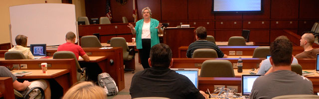 Professor teaching class full of students