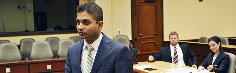 three people in a courtroom
