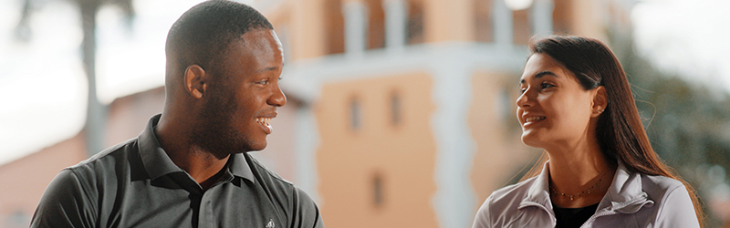 two students talking in the plaza mayor courtyard