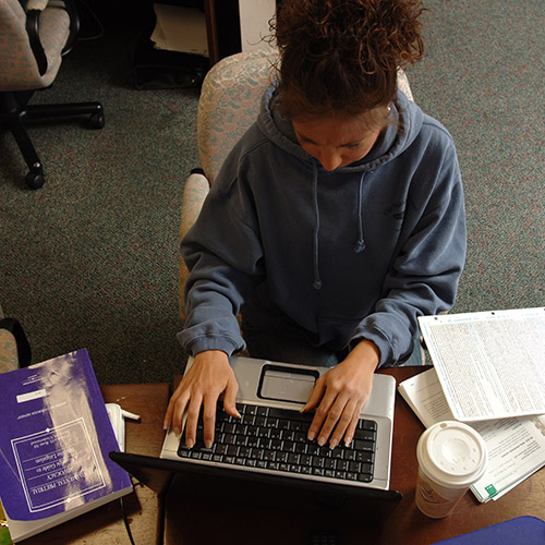 woman studying with computer