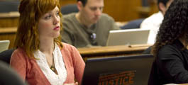 a woman studying in a class