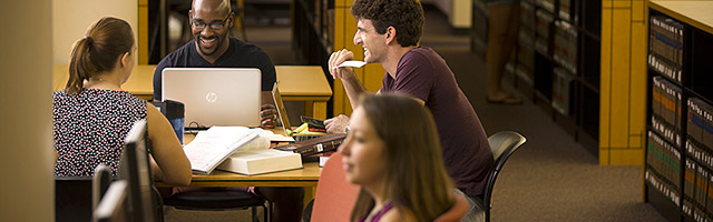 Students working in the Dolly & Homer Hand Law Library