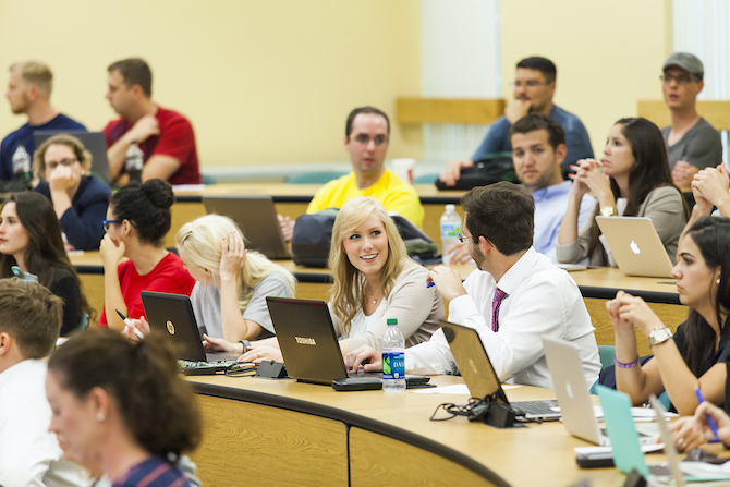 Numerous students sit inside a Stetson Law classroom