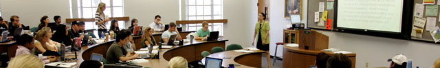 Teacher with students in large classroom