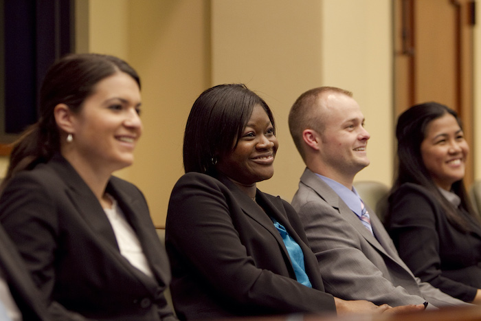 Four students smile during a class at Stetson Law