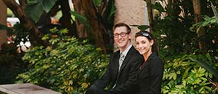 two students relaxing outside