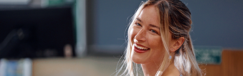 woman smiling in class
