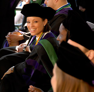 Stetson graduate smiling at graduation.