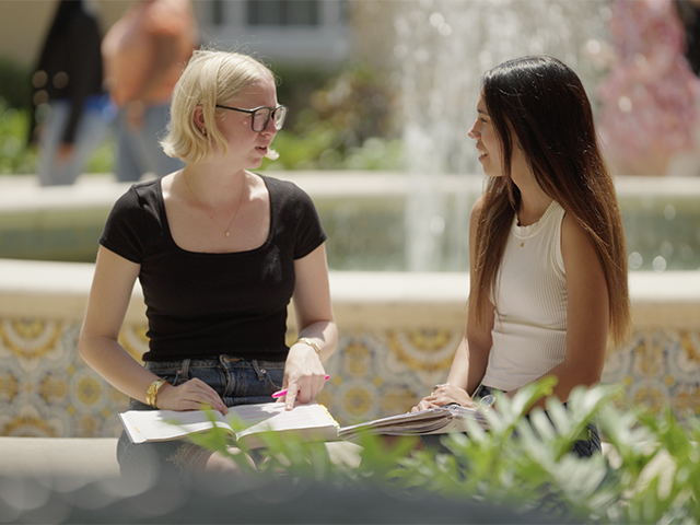 two students near the crummer fountain