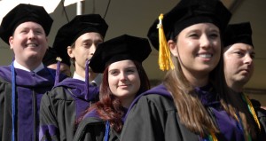 Graduates walk at Stetson Law commencement.