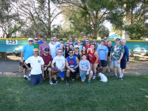 Students and alumni gather after the scholarship softball game for a photo. The alumni won the game. Photo courtesy Patricia Toups.