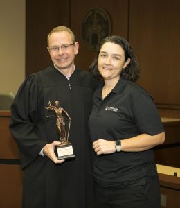 (L-R): Judge Michael Allen with Julia Metts accepting his award.