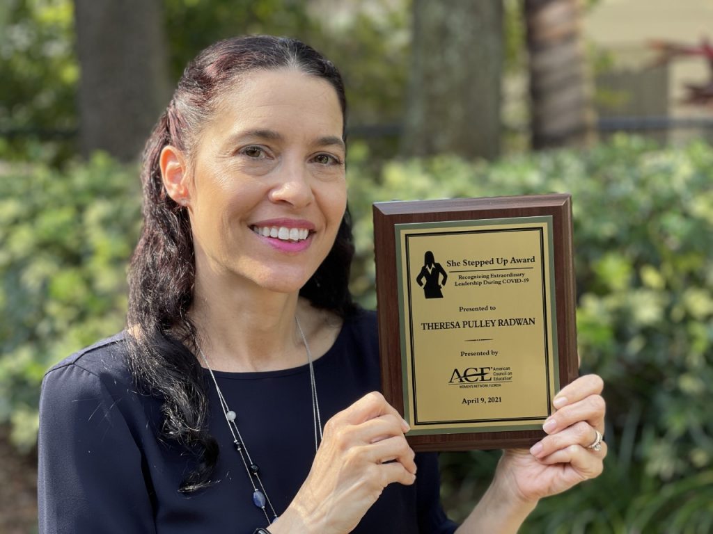 Prof. Theresa J. Pulley Radwan with her award.