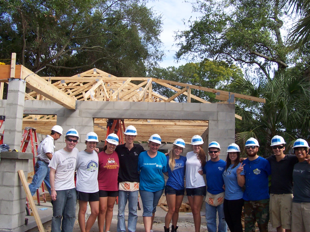 Group of volunteers outside Habitat for Humanity project