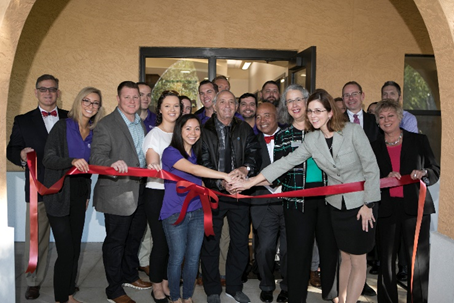 ribbon cutting outside of the building